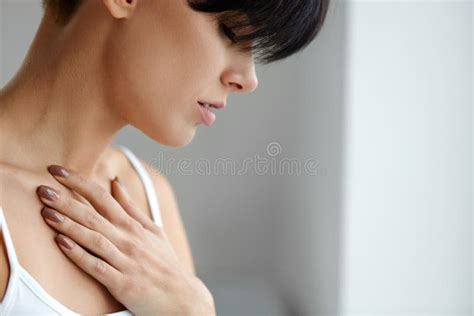 Beautiful Female Suffering From Painful Feeling Pain In Chest Stock