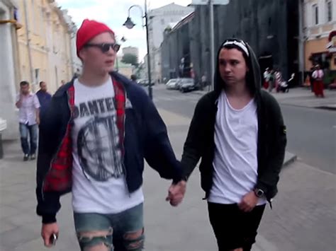 two men hold hands around moscow the reaction they face shows the hatred faced by lgbt