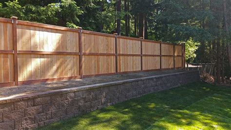 Unless specified otherwise, austex fence and deck sets the fence 1 to 2 inches off the ground and keeps the top of the fence straight. privacy fence - AJB Landscaping & Fence