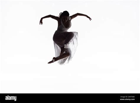 Young Graceful Ballerina Jumping In Dance Isolated On White Stock