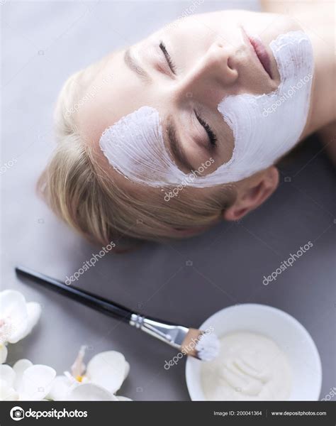 Face Maskbeautiful Young Girl At Spa Cosmetician Woman Applying