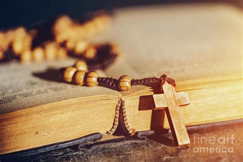 Rosary With Cross Laying On A Bible Book Photograph By Michal Bednarek