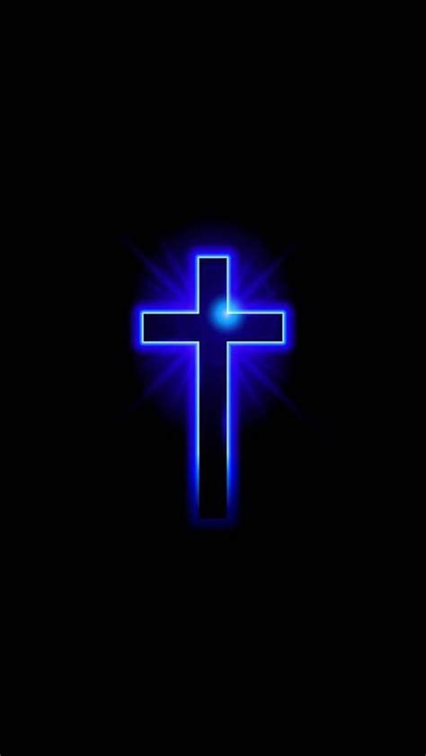 A Blue Glowing Cross On A Black Background