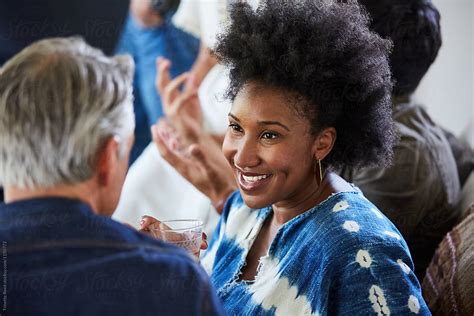 African American Woman With Group Of Friends And Family Having A