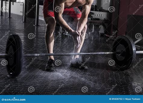 Closeup Of Muscular Athlete Clapping Hands Before Barbell Worko Stock