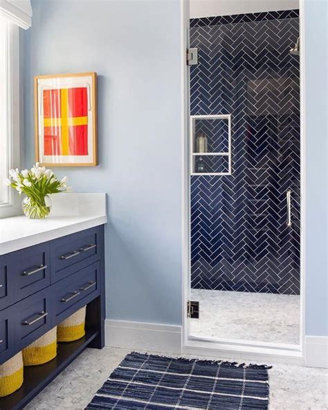 Navy Blue Herringbone Shower Wall Tile Navy Blue Vanity With Basket Storage Light Blue Walls