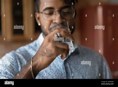 Thirsty Biracial Man Enjoy Clean Mineral Water Stock Photo Alamy