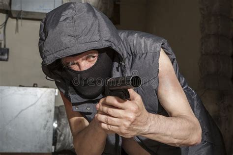 Armed Robber With A Gun In The Attic Stock Photo Image Of Dangerous