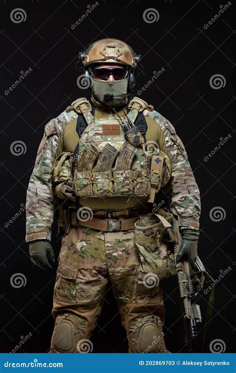 special forces soldier man in military gear protective mask glasses and mask hiding his face