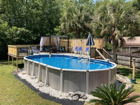 Interested in building a diy privacy fence? Above ground oval pool and deck with privacy fence | Oval ...