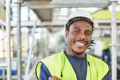 Portrait Of Happy Construction Worker At Site Stock Photo Dissolve