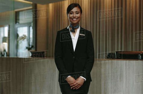 Happy Smiling Female Receptionist In Hotel Beautiful Concierge In Uniform Waiting For Welcoming