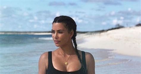 kim kardashian oozes sex appeal posing topless for sultry bed photo taken by kanye west mirror