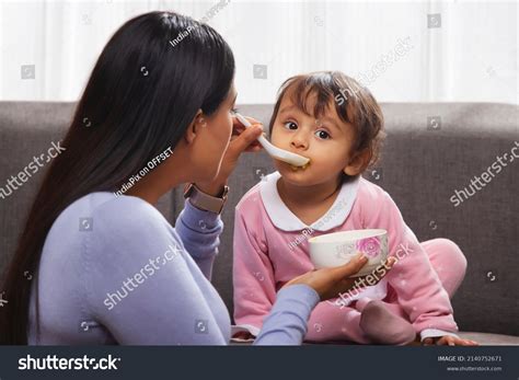 Mother Feeding Her Baby Spoon Living Stock Photo 2140752671 Shutterstock