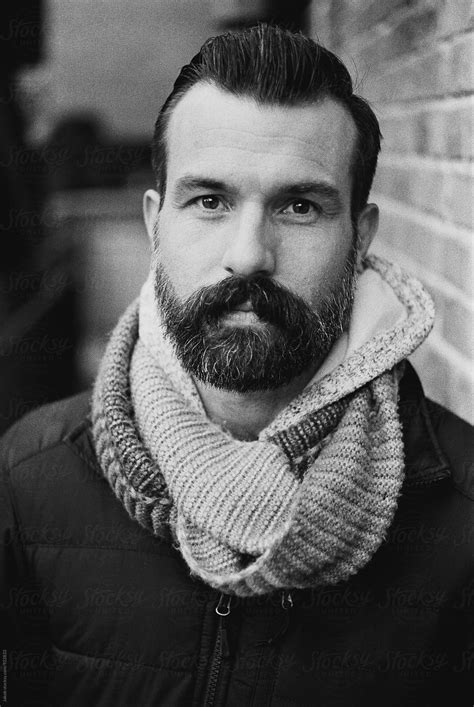 Black And White Portrait Of A Handsome Man With A Beard By Stocksy