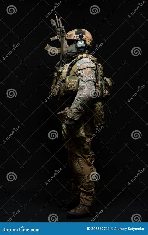 Full Length Side View Portrait Of An Army Soldier Standing In Full