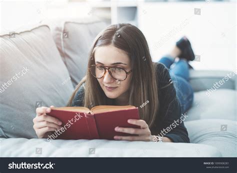 Young Girl Reading Book While Lying Stock Photo 1099908281 Shutterstock