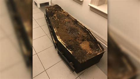 Protesters March In Asheville Leave Casket Full Of Dirt At Police