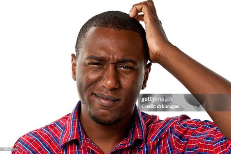 Confused Young Male Scratching His Head High Res Stock Photo Getty Images