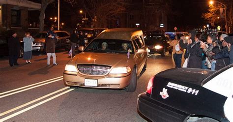 whitney houston s body returns home to new jersey as locals celebrate her life in the streets