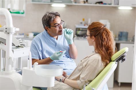 Dentist Talking To Patient About Dental Care Wharton Dental Blog
