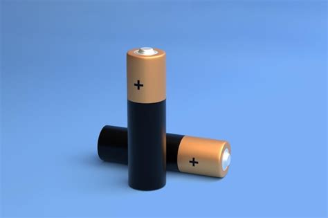 Premium Photo Two Aa Size Batteries Isolated On Blue Background Close