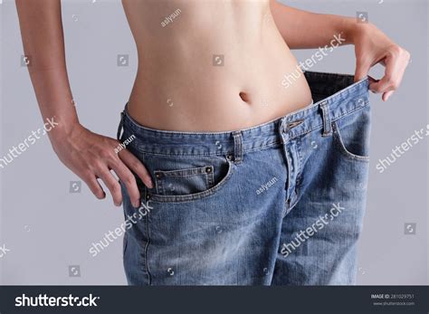 Woman Shows Weight Loss By Wearing Foto Stock 281029751 Shutterstock
