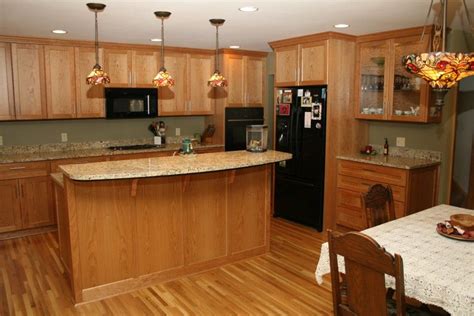 Oak is a very hard, heavy wood that's strong and durable. Flooring | Wood floor kitchen, Honey oak cabinets, Oak kitchen