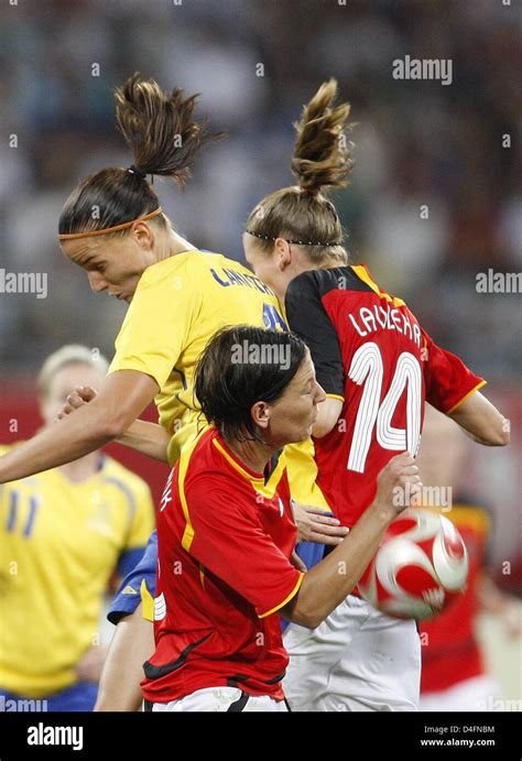 Simone Laudehr R And Linda Bresonik C Of Germany Vies With Jessica Landstrom L Of Sweden