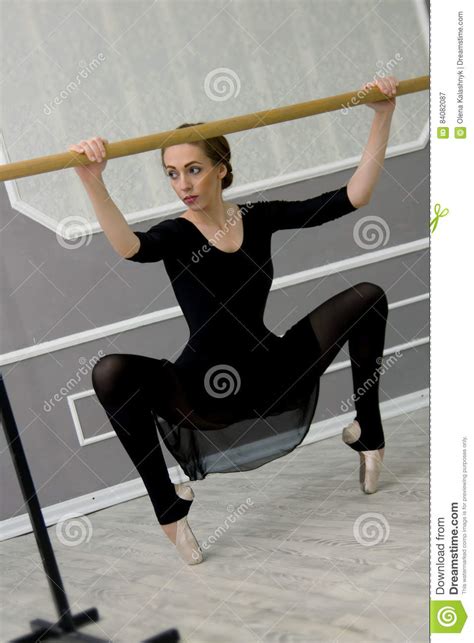 Pretty Young Graceful Ballet Dancer Warms Up In Ballet Class Stock