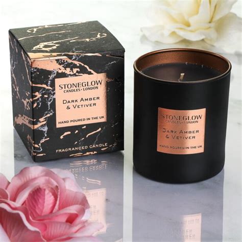 stoneglow luna dark amber and vetiver candle temptation ts