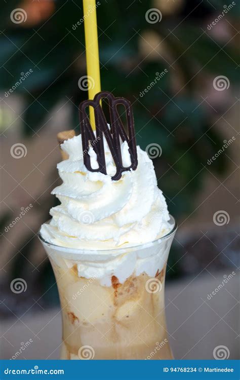 Delicious Iced Coffee With Whipped Cream On A Glass Cup Stock Photo
