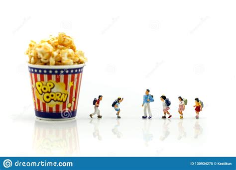 Miniature People Kid With Popcorneating And Fun Concept