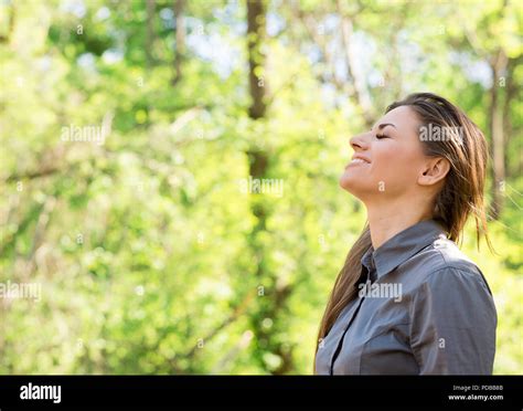 Side View Of Happy Woman Taking Deep Breath And Closing Eyes Enjoying Freedom And Nature Summer