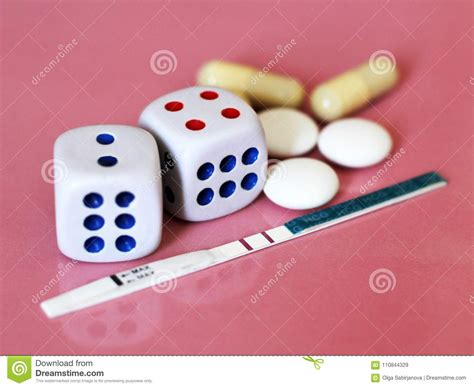 Pregnancy Test Positive With Two Stripes And Contraceptive Pill The Dice On Pink Background