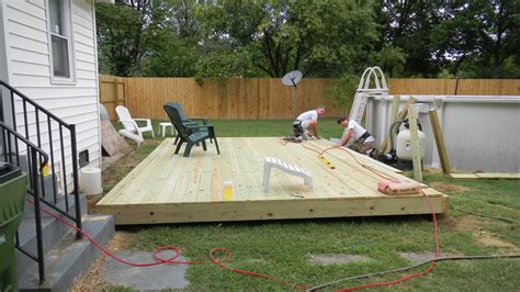 After laying down the tarp on a leveled area. ground level small rectangular deck | Ground level deck ...