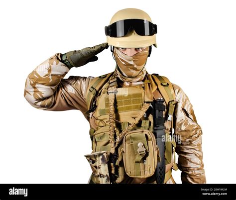 isolated photo of a fully equipped soldier in uniform armor helmet and glasses standing