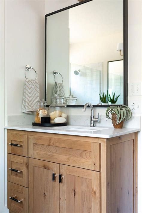 Modern farmhouse is the name for this hybrid style, combining modern color schemes, shapes, and materials with the rustic warmth of untreated wood the oversized farmhouse sink exposed lightbulbs and stone floating vanity give the bathroom a retro, almost industrial feel. Mid-century Modern Farmhouse - Home Bunch Interior Design ...