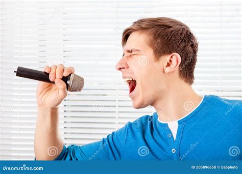 Young Man With A Microphone Stock Photo Image Of Hand Karaoke 205896658