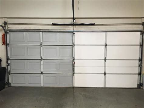 If needed, you can use a little bit of masking or duct tape to help you hold each foam panel in place as the glue dries. DIY Garage Door Insulation Installation in Steamy Arizona | Insulfoam
