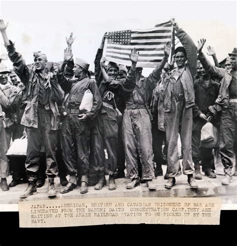 1945 americans liberated from japanese prison camp american flag waves over narumi american flag
