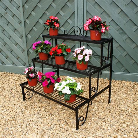 Overall, the stand with legs included measures 20 inches tall and is a good size for many indoor and outdoor plants such as. Solid Steel Two Or Three Tier Garden Plant Stand By The ...