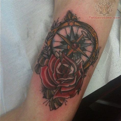 Compass And Red Rose Tattoo On Bicep