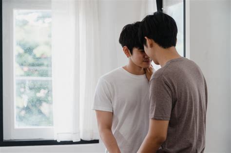 Free Asian Gay Couple Standing And Hugging Near The Window At Home Young Asian Lgbtq Men