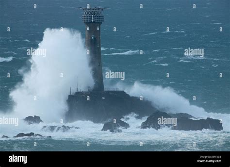 Longships Lighthouse In Stormy Seas Stock Photo Alamy