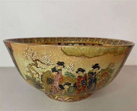 A Decorative Bowl Is Sitting On A Table