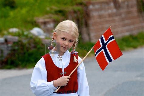 Scandinavian Lifestyle A Little Girl With National Flag Of Norway By