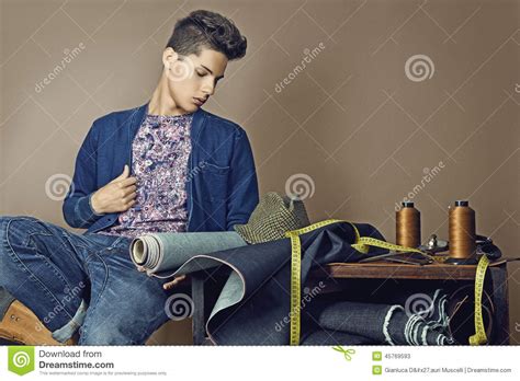 Fashion Portrait Of Handsome Young Man With Tools For Sewing Den Stock