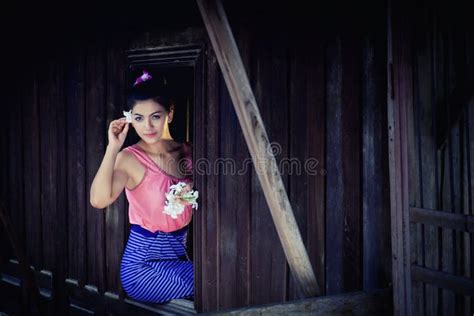 portrait beautiful woman wearing traditional thai culture vintage style standing by a window
