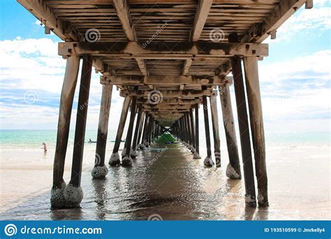 One Point Perspective Shot Taken Underneath A Wooden Jetty Or Pier